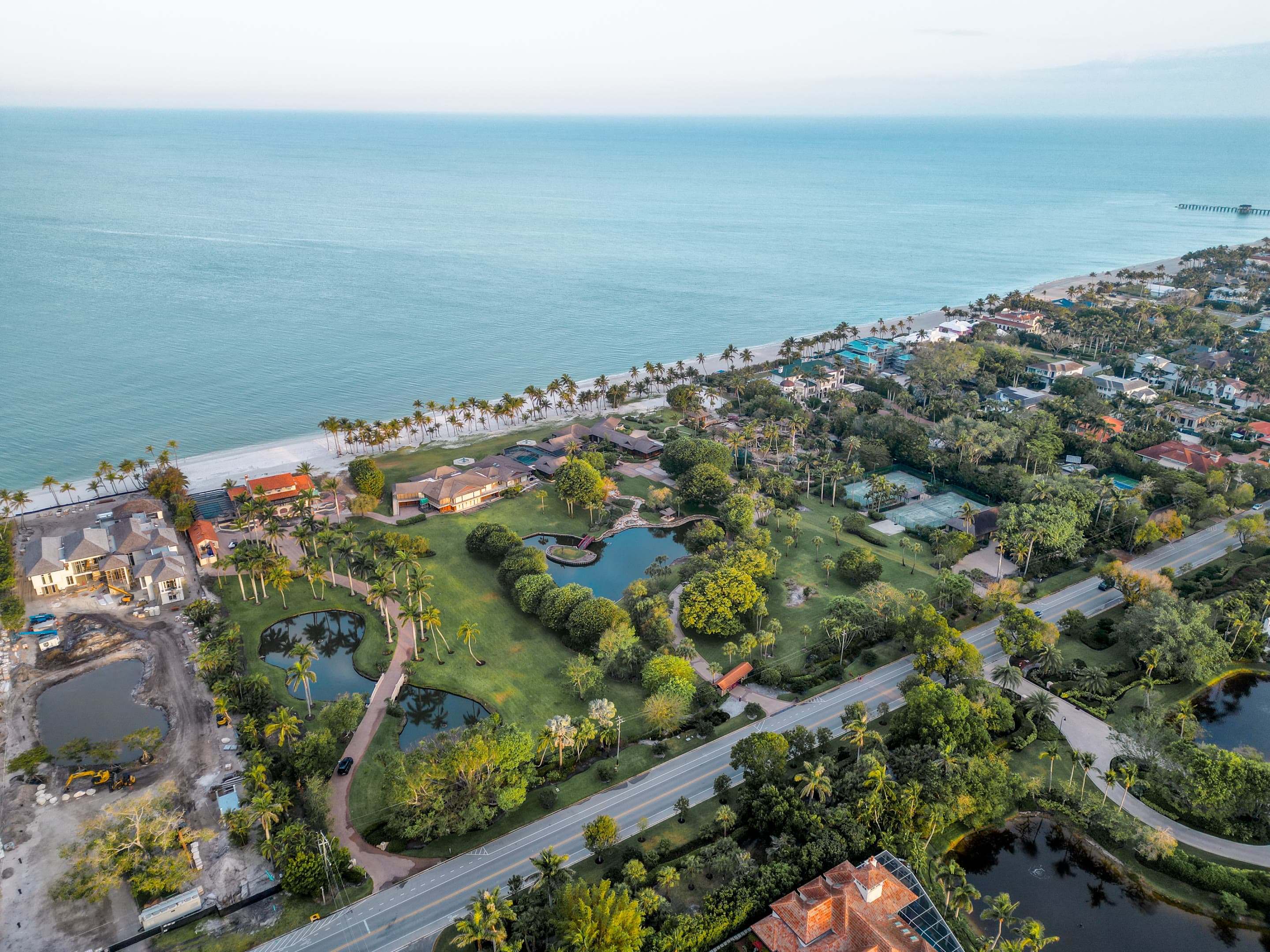 Dawn aerial of a Gordon Drive beachfront estate in Naples