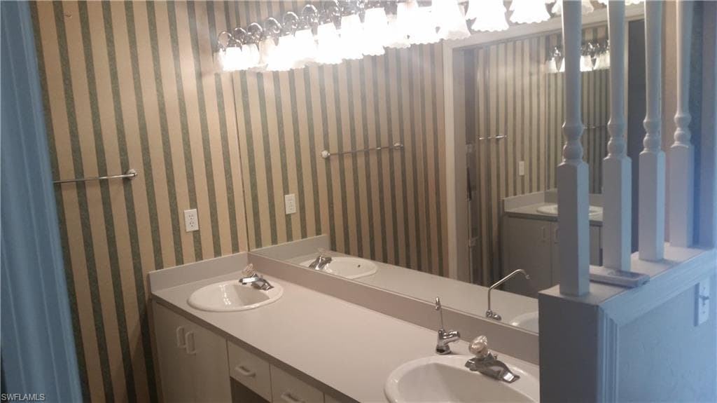 Master Bed Room Double Sinks and full wall mirror
