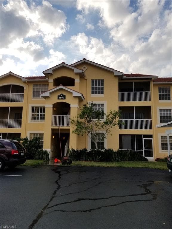 Exterior of building upper right unit is subject property