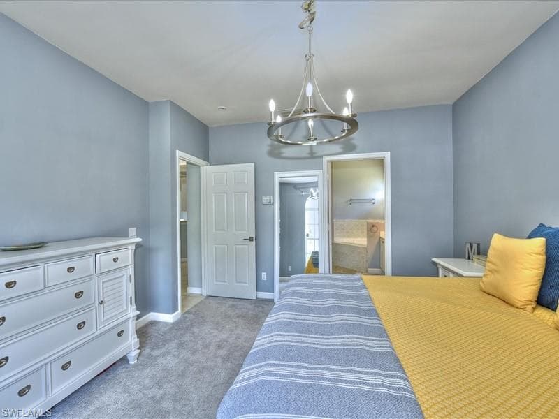 Master bedroom with walk-in closet to the left.