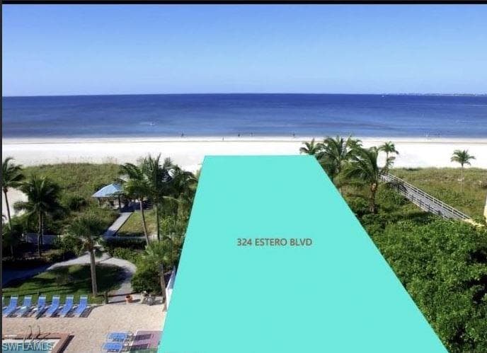 View of property's community with a water view and a view of the beach