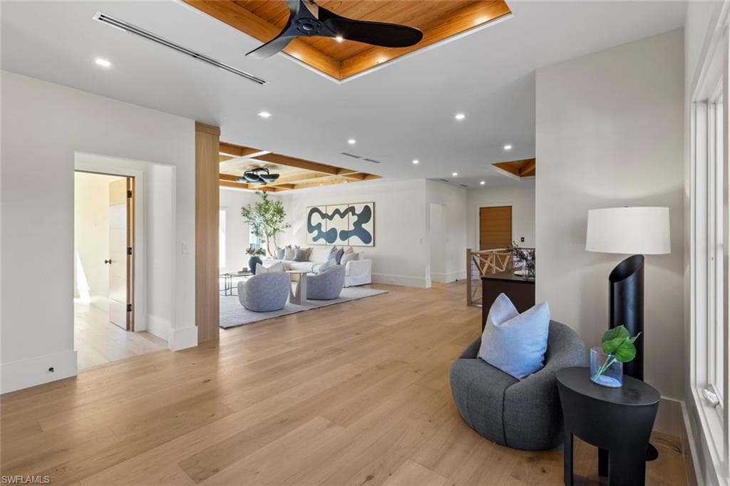Second floor Living area featuring wooden ceiling, ceiling fan, recessed lighting, light wood-type flooring, and a raised ceiling