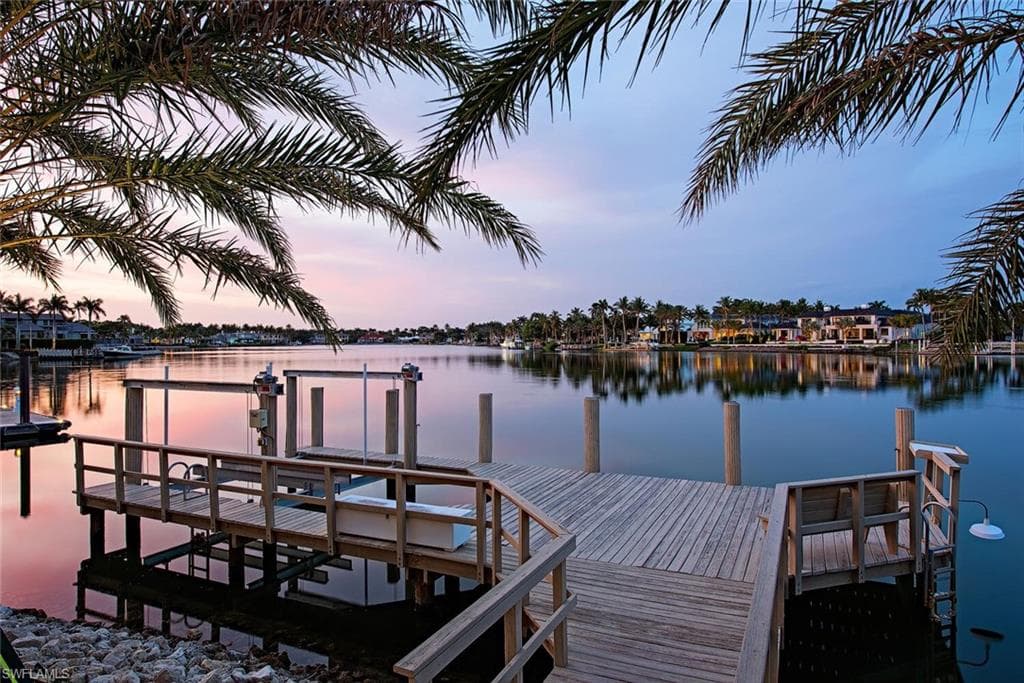 Dock area featuring a water view
