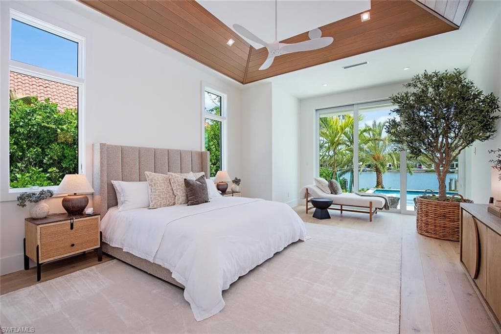 Bedroom with recessed lighting, light wood-style flooring, and access to exterior