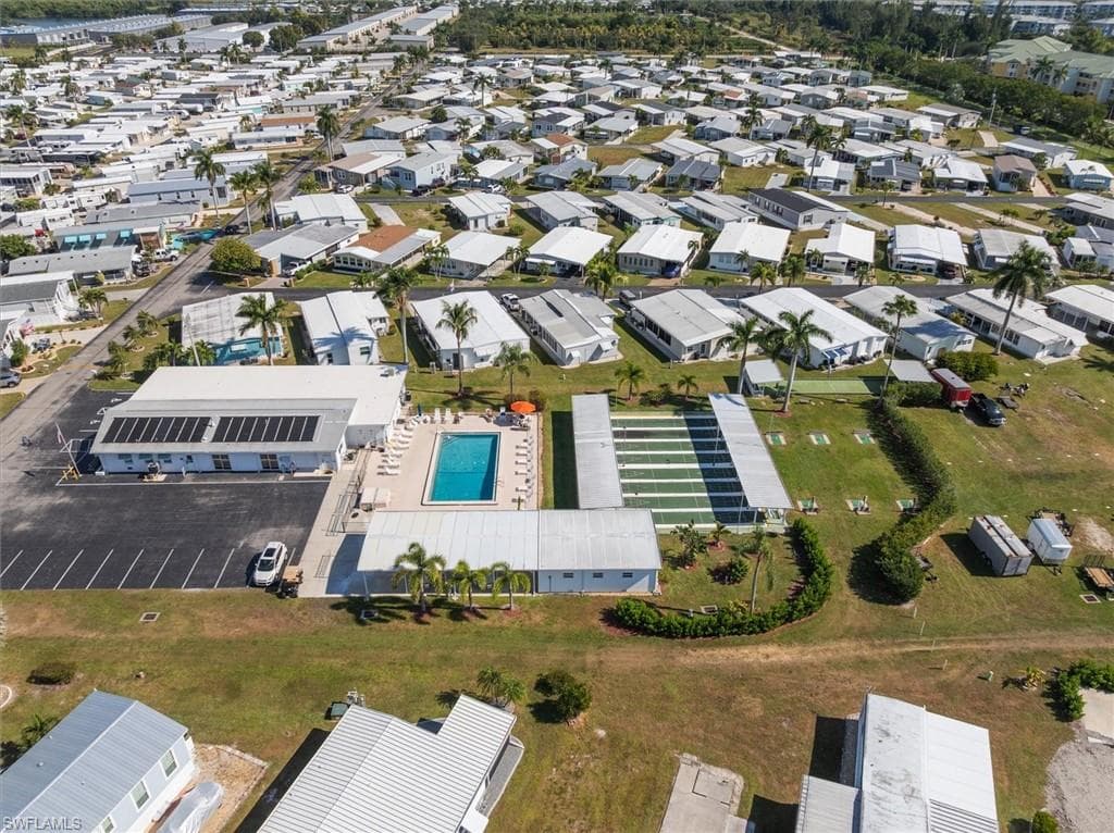 Aerial overview of property's location with nearby suburban area