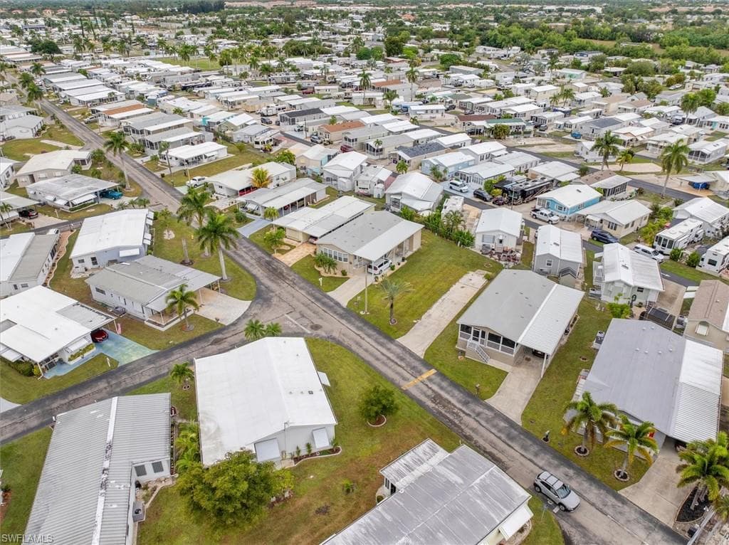 Aerial view of property's location featuring nearby suburban area