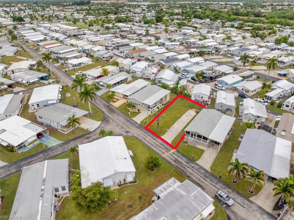 Aerial perspective of suburban area with property parcel outlined