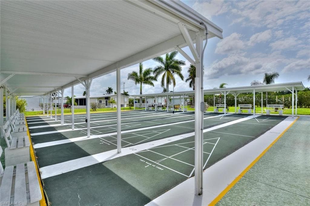 View of home's community featuring shuffleboard