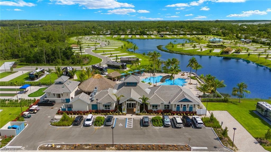Clubhouse aerial view featuring a water view