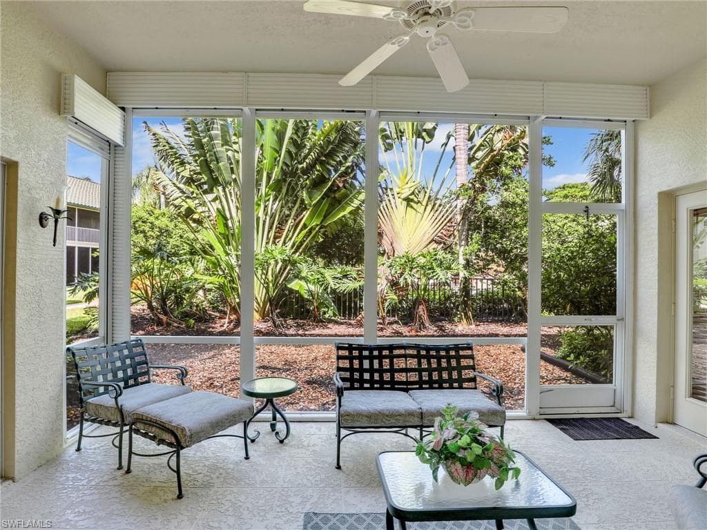 Sunroom featuring ceiling fan