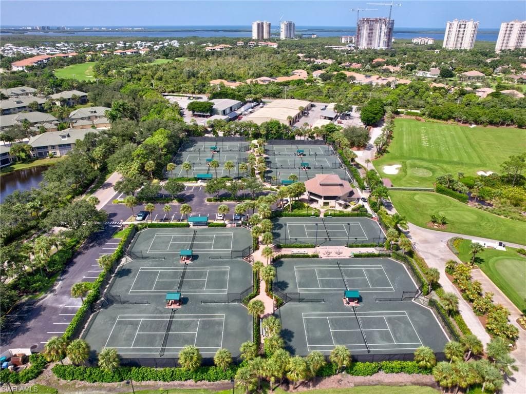 Birds eye view of Tennis Courts featuring a water view
