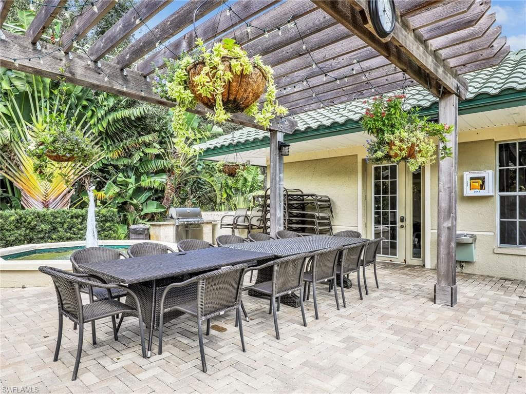 View of patio / terrace featuring area for grilling, a pergola, and french doors