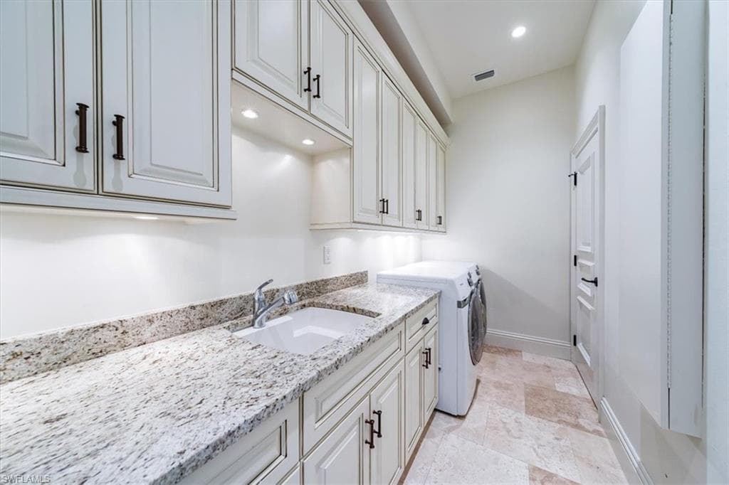 Large laundry room with additional storage closet