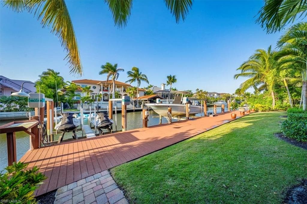 84 ft Azek dock which has a 13,000-pound capacity boat lift, double jet ski lift, filet table and fish light