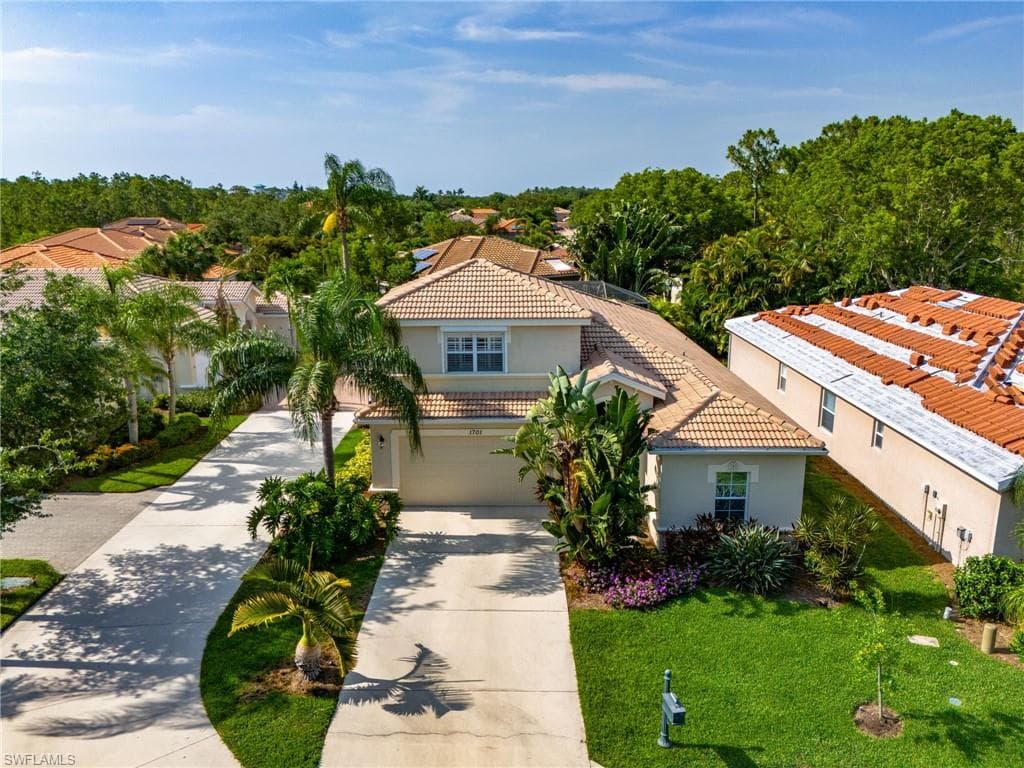 Mediterranean / spanish house featuring a front lawn