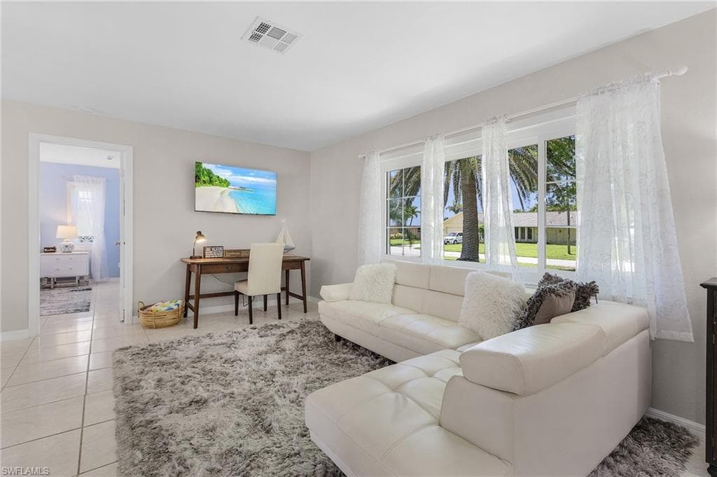 Living room with light tile flooring