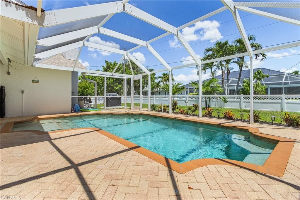 View of pool featuring a patio and a lanai