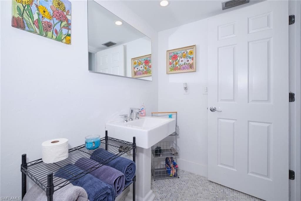 Bathroom featuring tile flooring