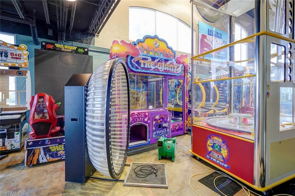 Game room with concrete flooring