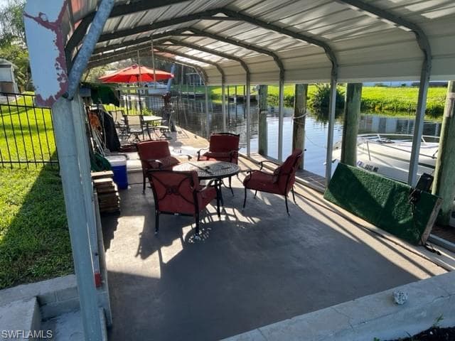 Dockside covered area for entertaining. Easy on and off boat. Davit in distance works but Seller doesn't use it so not guaranteed to be working.