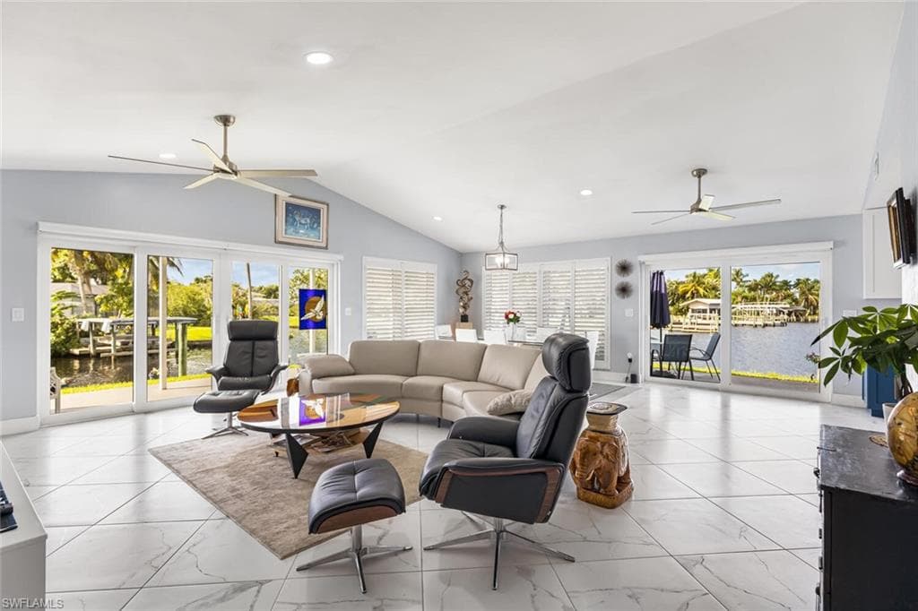 Porcelain tile 24" x 24" set on diagonal throughout home. Window coverings are remote controlled blinds. Volume ceilings and recessed lights are great features.