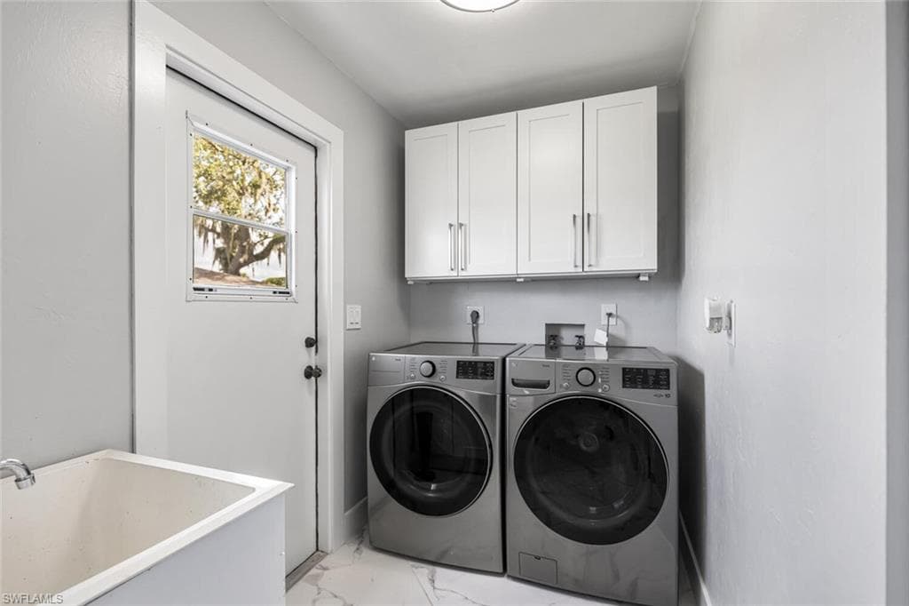 Laundry Room off of Kitchen has LG Full-Sized Washer and Dryer. Laundry Tub. Side door to backyard.