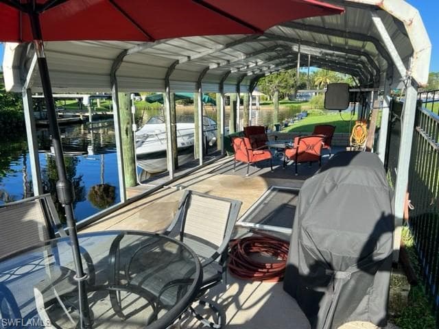 View of dock with a water view