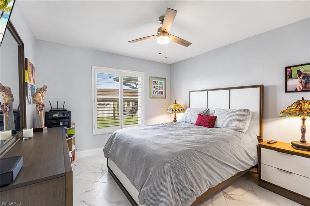 Spacious guest bedroom with closet. View is to side yard.