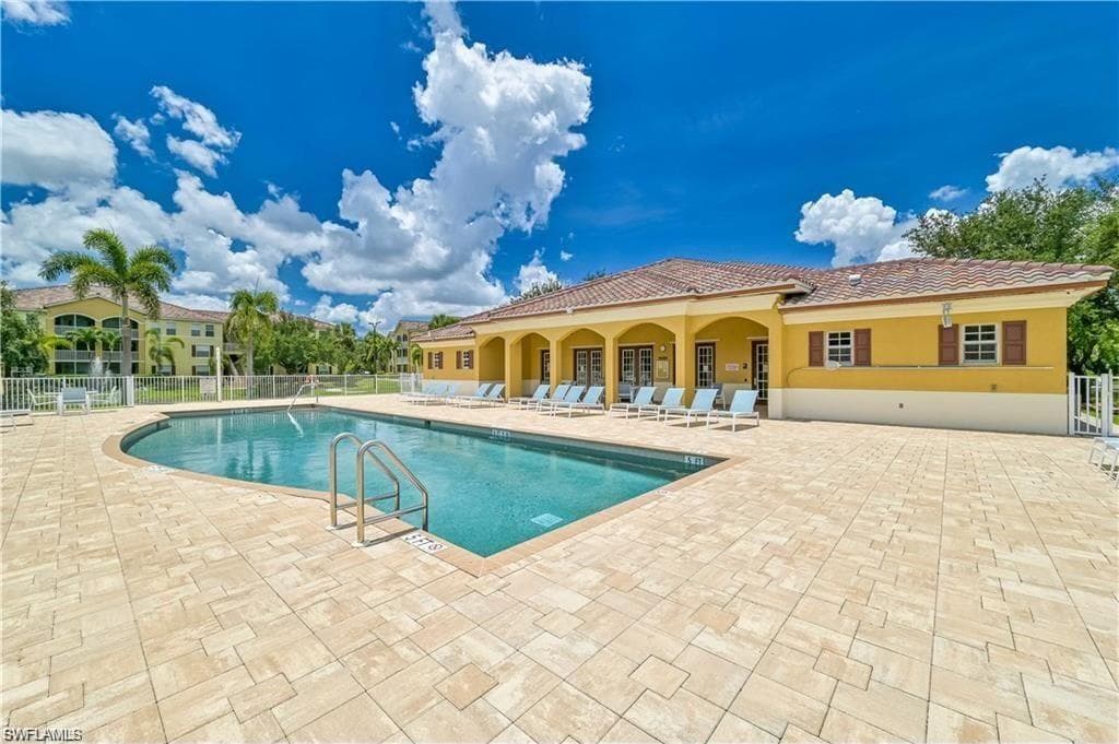 View of swimming pool with a patio area