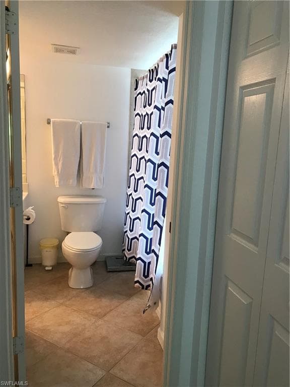 Bathroom with tile floors and toilet