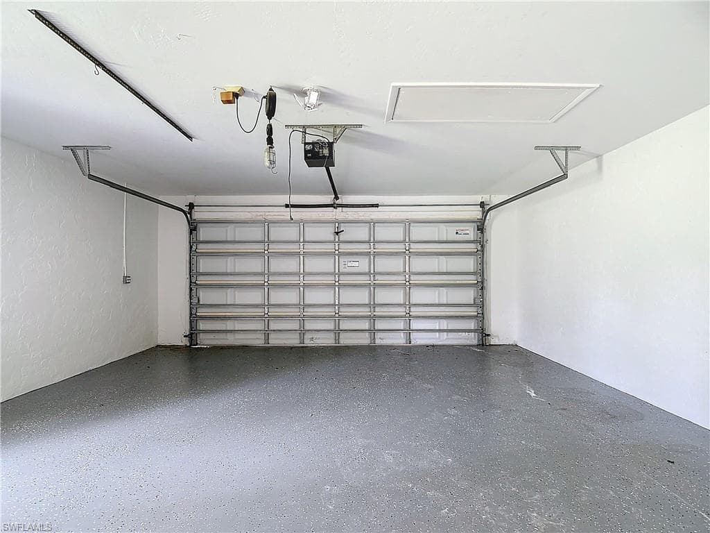 Garage featuring a garage door opener