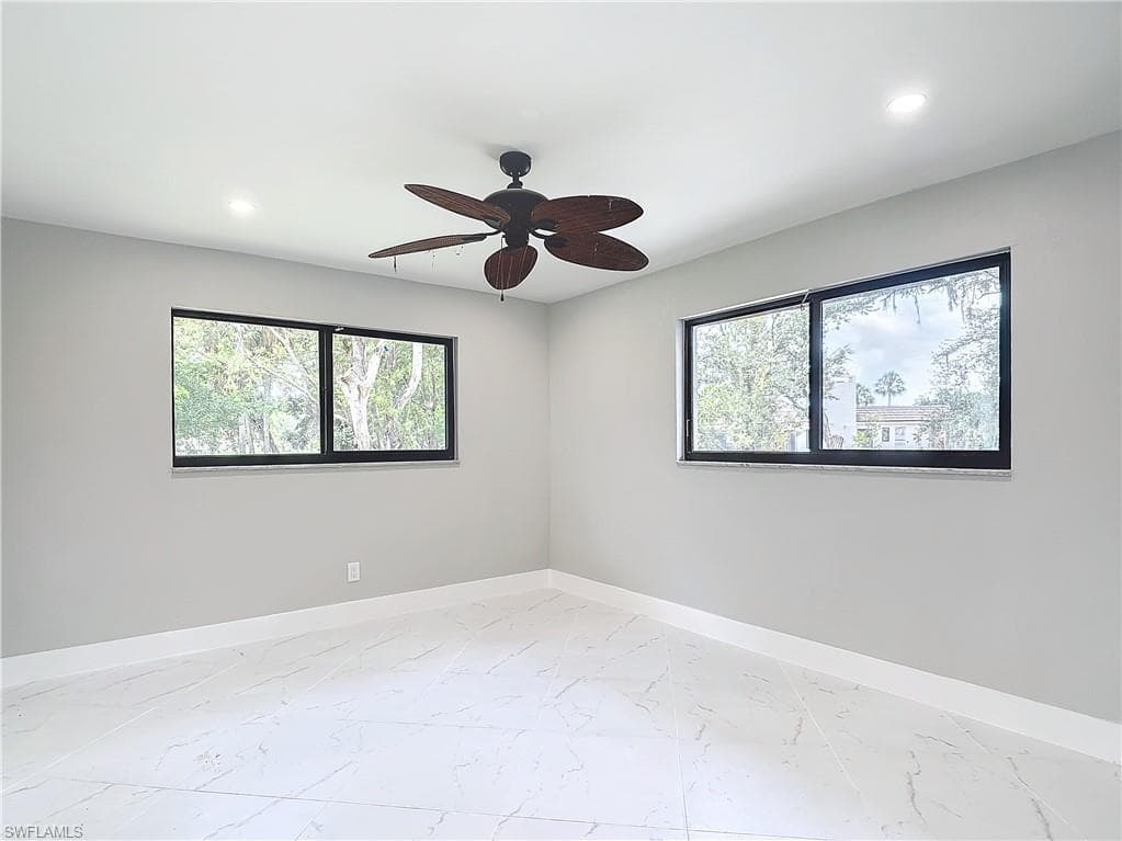 Unfurnished room featuring ceiling fan