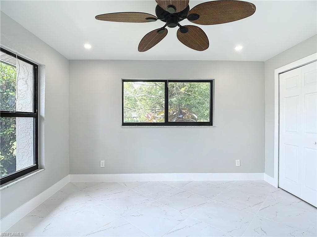 Unfurnished bedroom with tile flooring, a closet, and ceiling fan