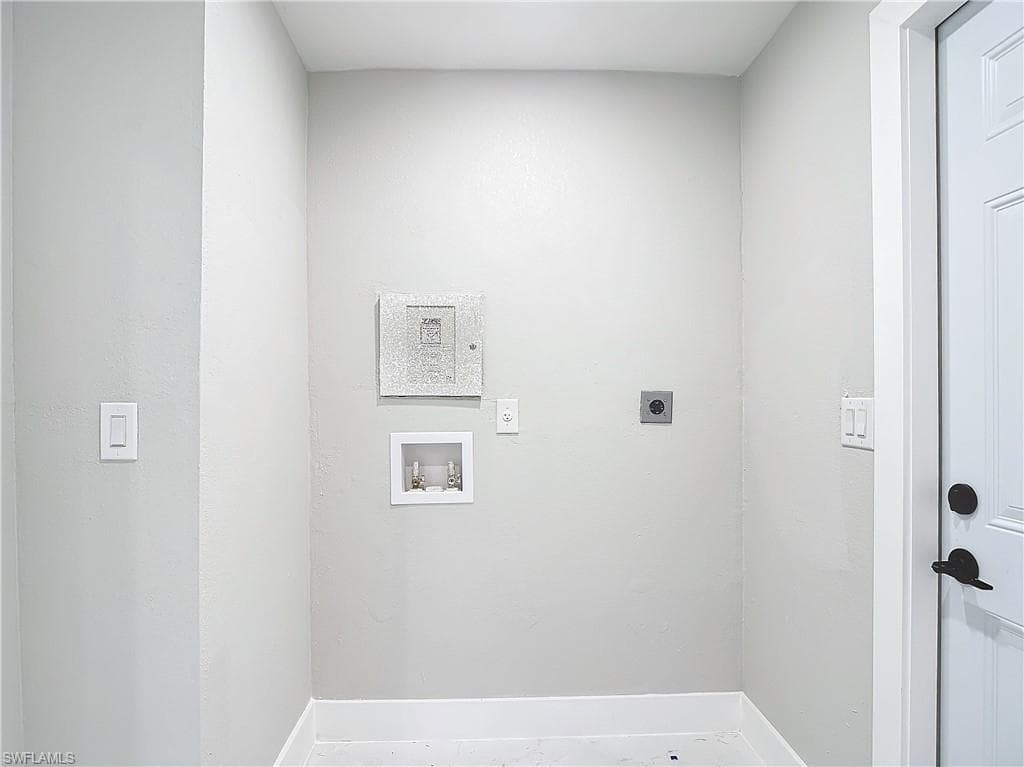 Laundry area with hookup for a washing machine and electric dryer hookup