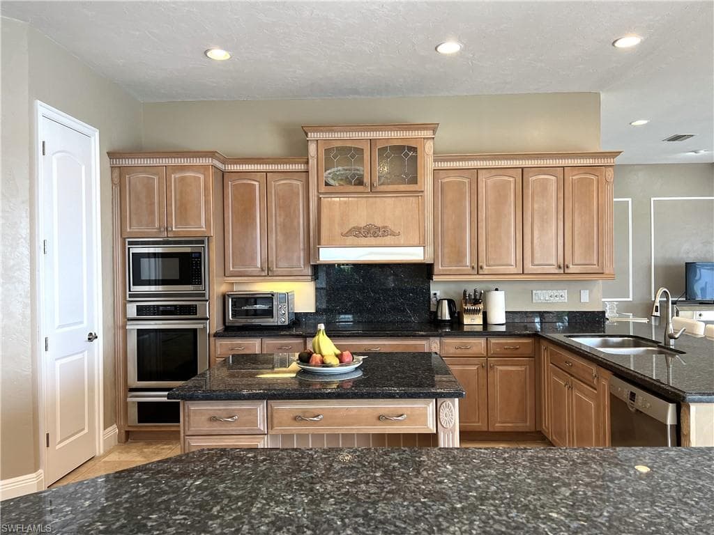 Newer Kitchen cabinets, black granite tops, Thermador ovens and warmer