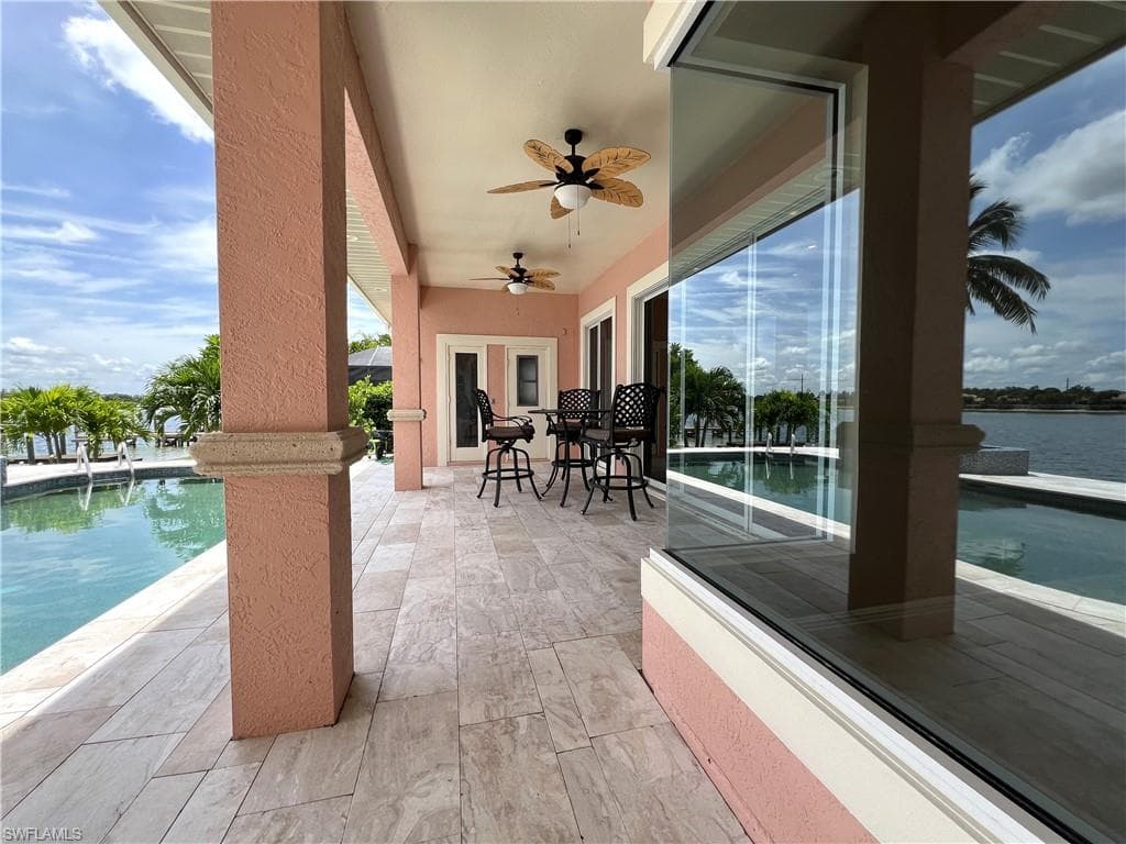 View of patio / terrace with ceiling fans