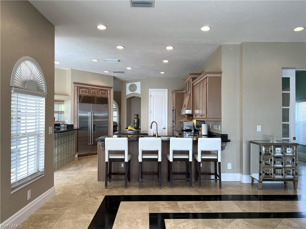 Kitchen sink faces the spectacular lake view in the Family Room