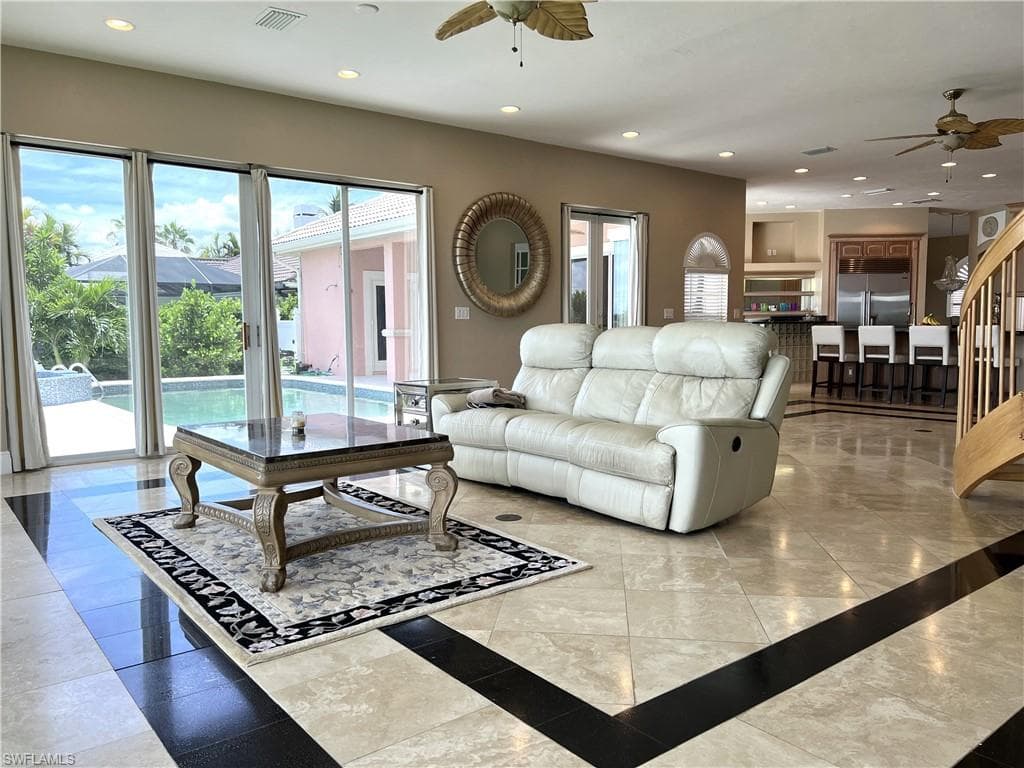 Family Room opens onto the pool deck. Very light and comfortable