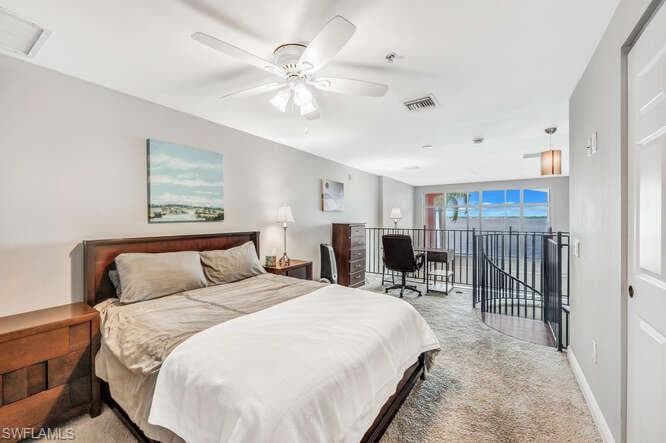 Carpeted bedroom with ceiling fan