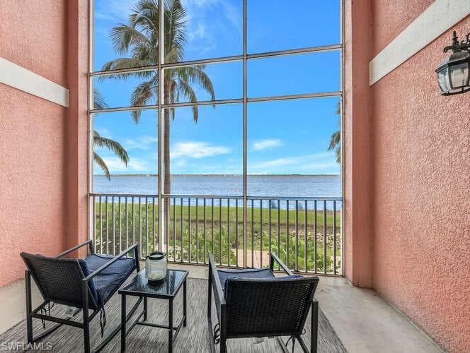 Sunroom / solarium with a water view