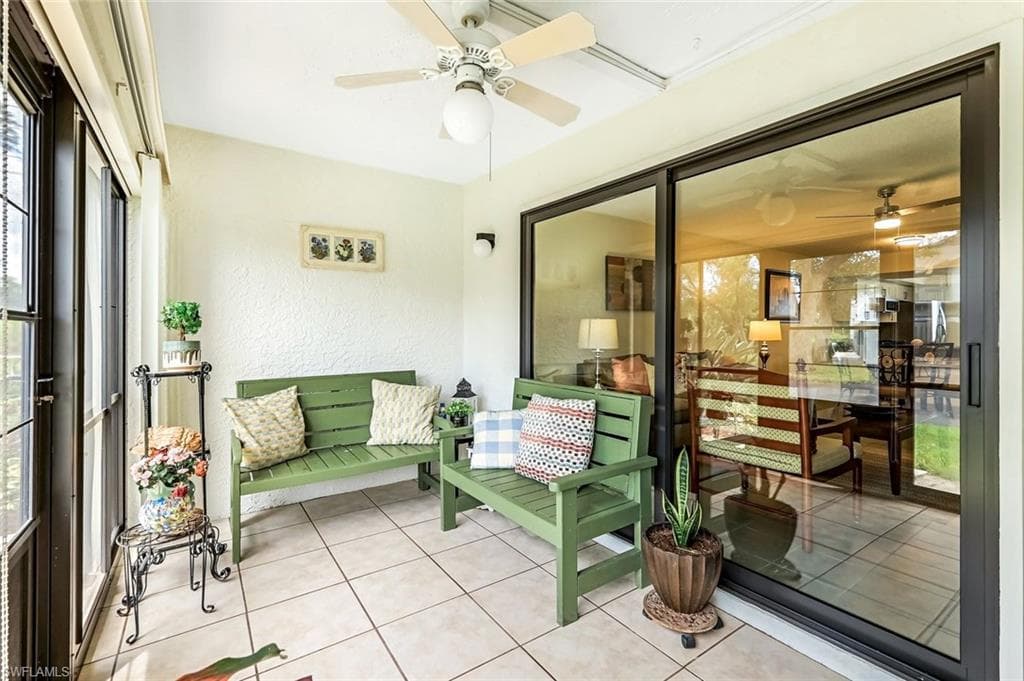 Sunroom featuring ceiling fan