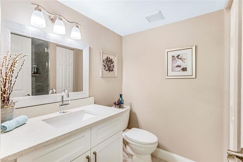 Bathroom with toilet and vanity
