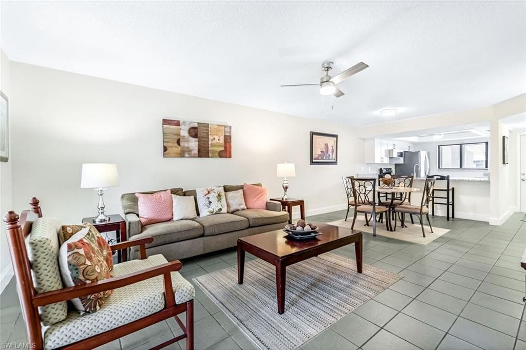 Tiled living room with ceiling fan