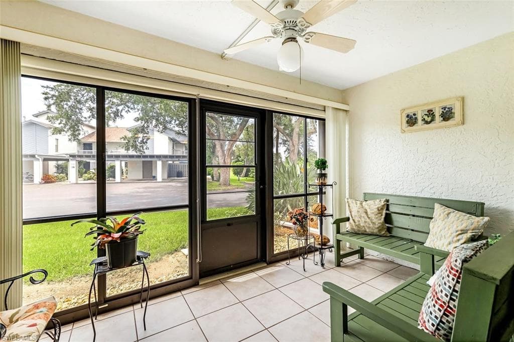 Sunroom / solarium featuring a wealth of natural light and ceiling fan