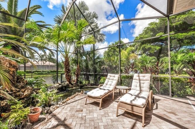 Unfurnished sunroom with a water view