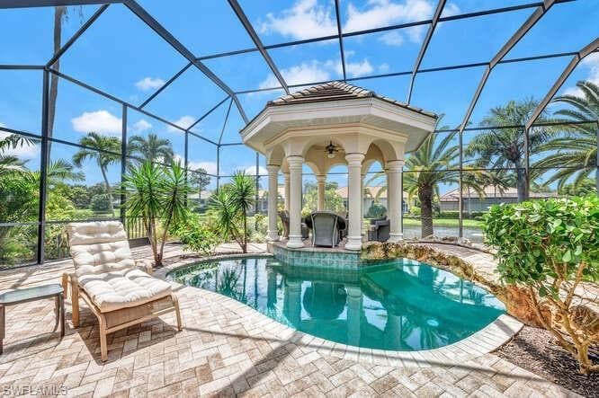 View of pool featuring a lanai and a patio