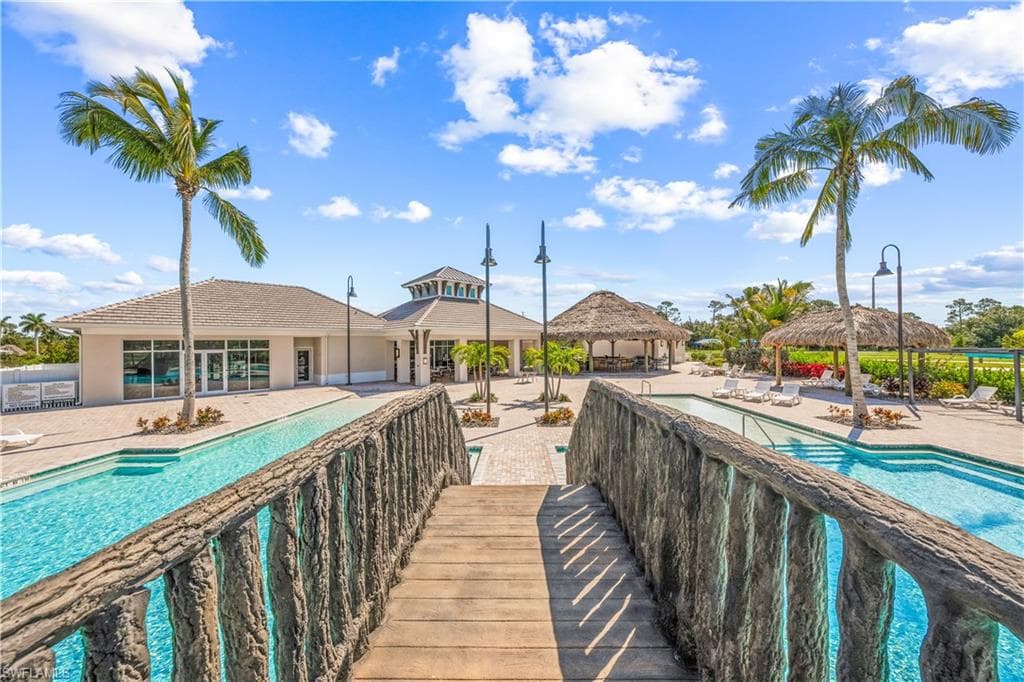 View of home's community featuring a swimming pool, a gazebo, and a patio area