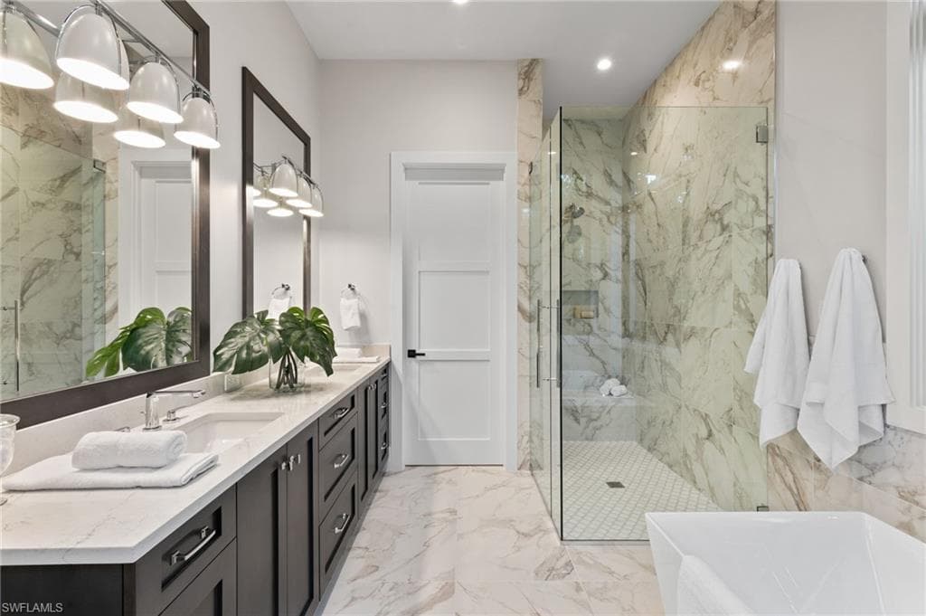 Primary Bath with Exquisite Porcelain Marble-Look Tile and Private Water Closet