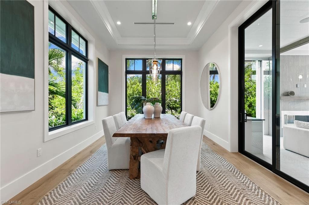 The Dining Room Views are filled with Palm Trees and private side yard