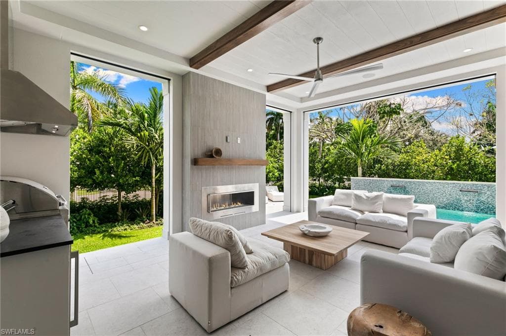 Outdoor Living features Fireplace, Kitchen and beamed ceiling overlooking the Pool